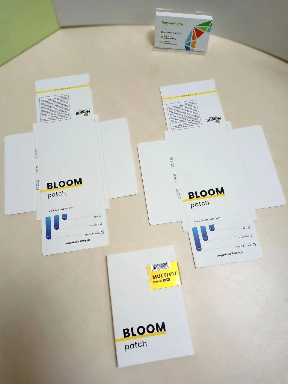 Cardboard packaging 132×92×7 mm with spot varnish and shaped die-cutting, overall view