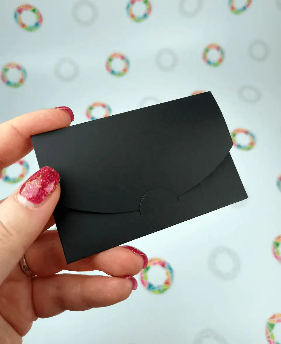 Back of a black designer envelope without print, folded
